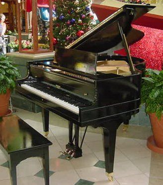 PREMIER BABY GRAND PIANO  